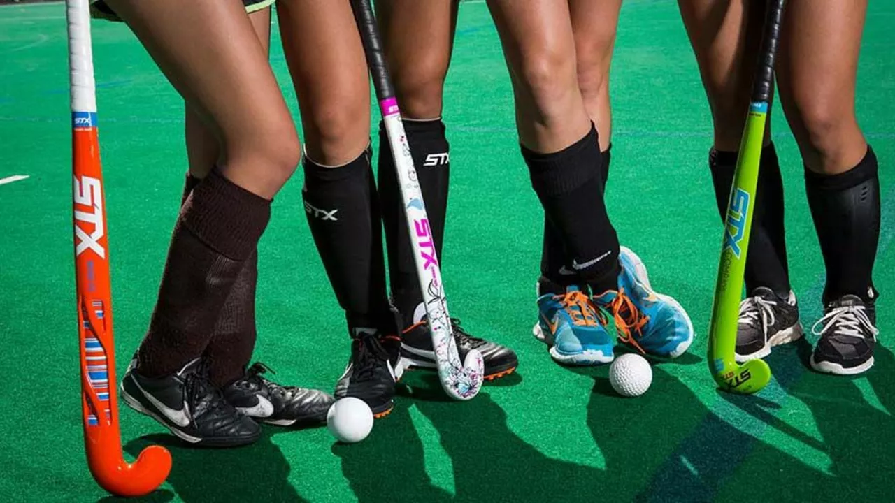Why was artificial turf introduced in (Field) Hockey?